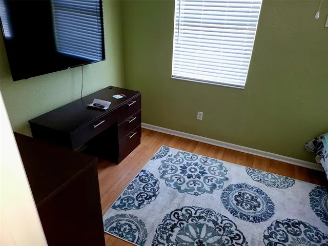 a black and white wall with a black and white comforter