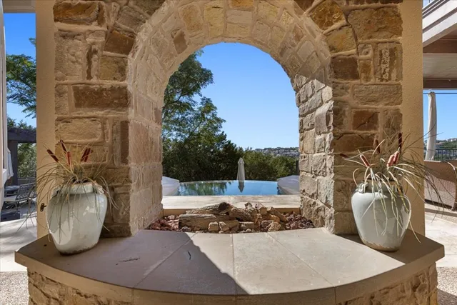 a view of a couches chair and table in a patio