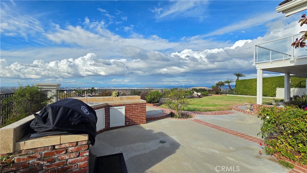a view of a swimming pool with a yard