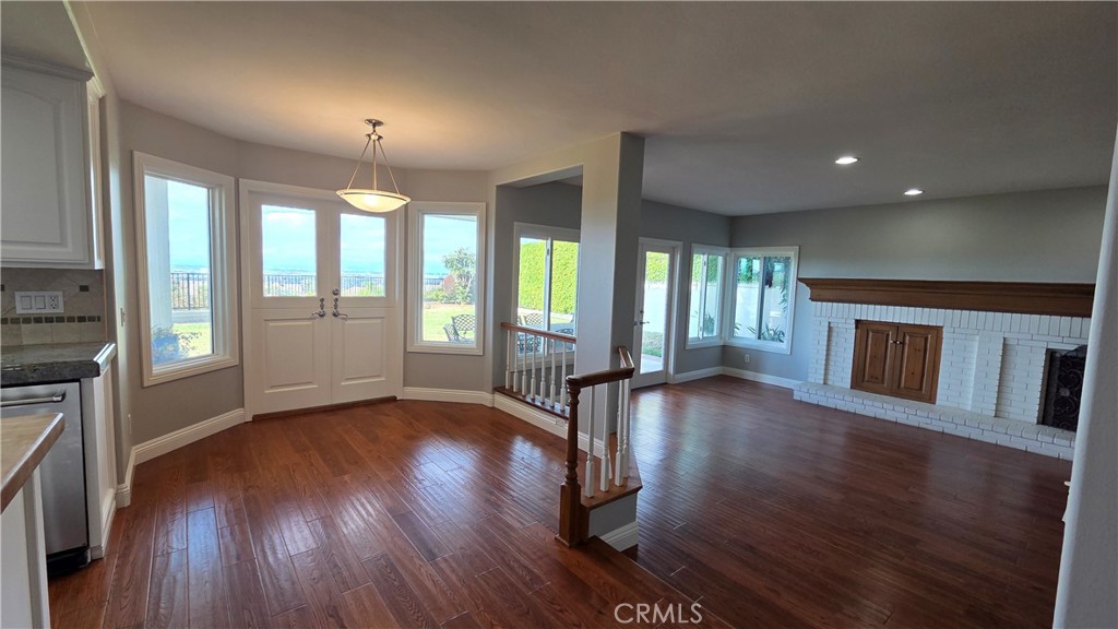 8 Miranda Irvine, CA 92603 - Photo 13 of 32 an empty room with wooden floor and fireplace