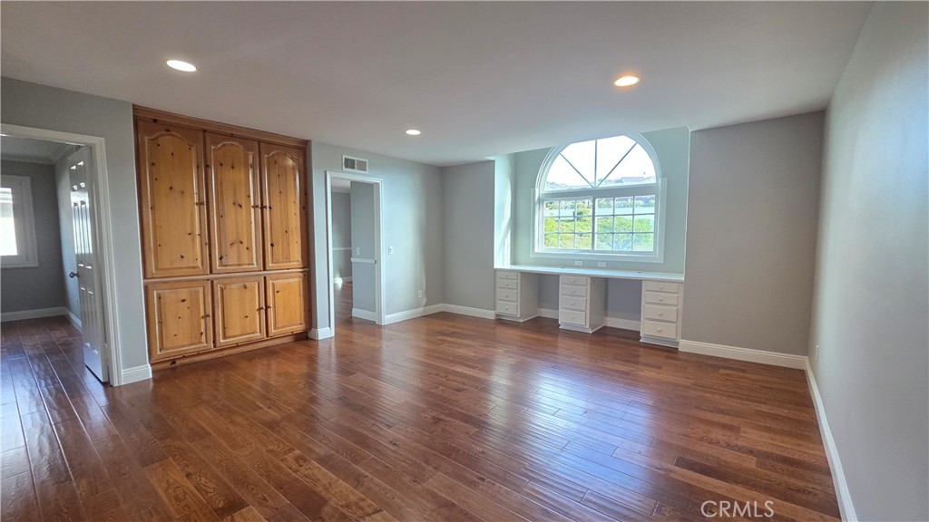 8 Miranda Irvine, CA 92603 - Photo 22 of 32 an empty room with wooden floor and windows