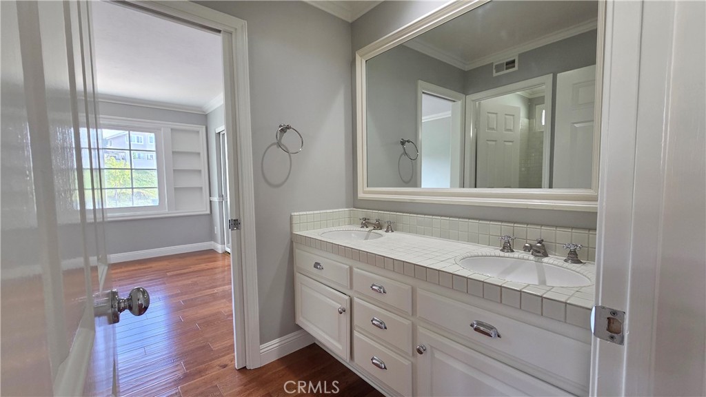 8 Miranda Irvine, CA 92603 - Photo 23 of 32 a bathroom with a granite countertop sink mirror and double