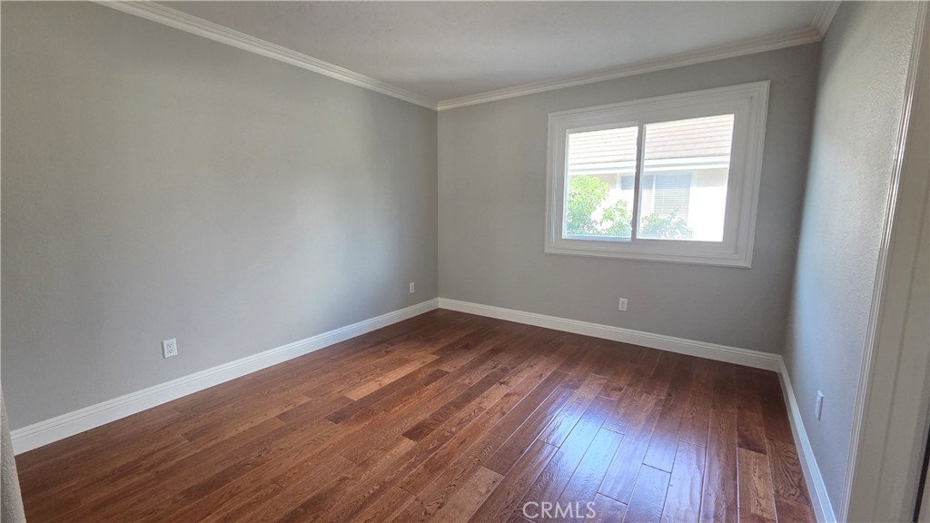 8 Miranda Irvine, CA 92603 - Photo 25 of 32 an empty room with wooden floor and windows
