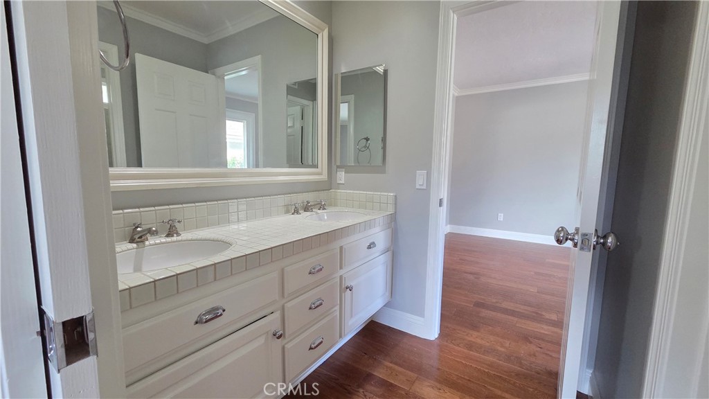 8 Miranda Irvine, CA 92603 - Photo 27 of 32 a spacious bathroom with a double vanity sink a mirror and a shower