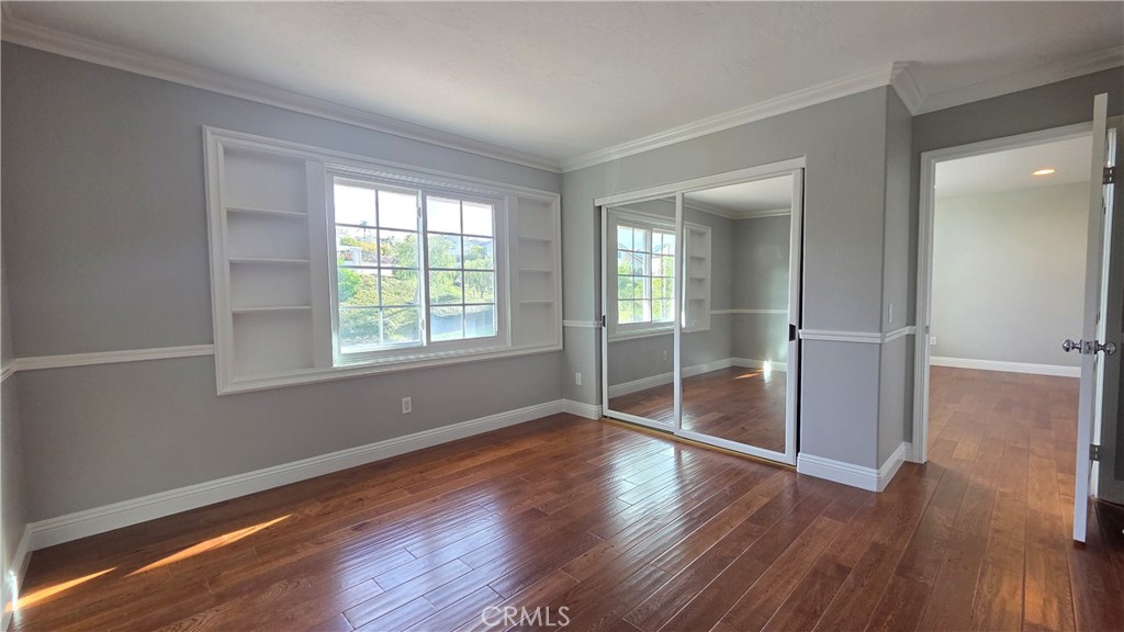 8 Miranda Irvine, CA 92603 - Photo 28 of 32 an empty room with wooden floor and windows