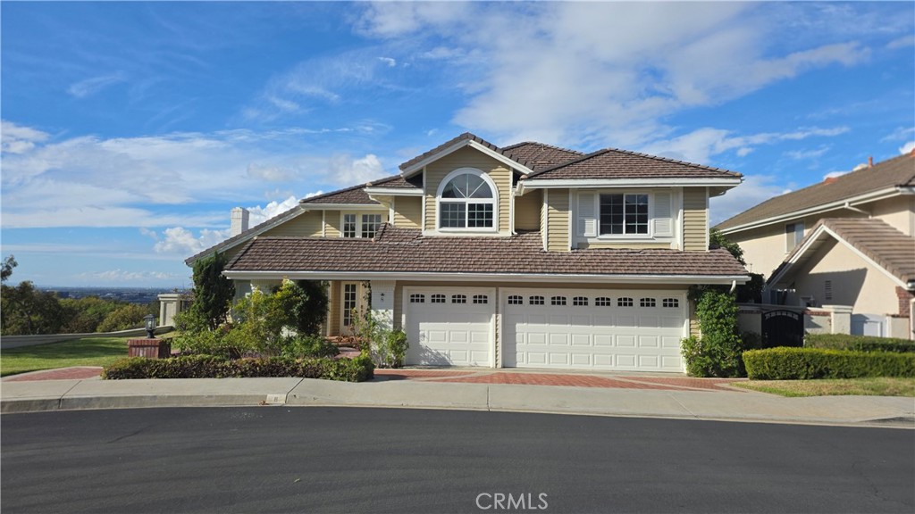 8 Miranda Irvine, CA 92603 - Photo 4 of 32 a front view of a house with a yard and garage