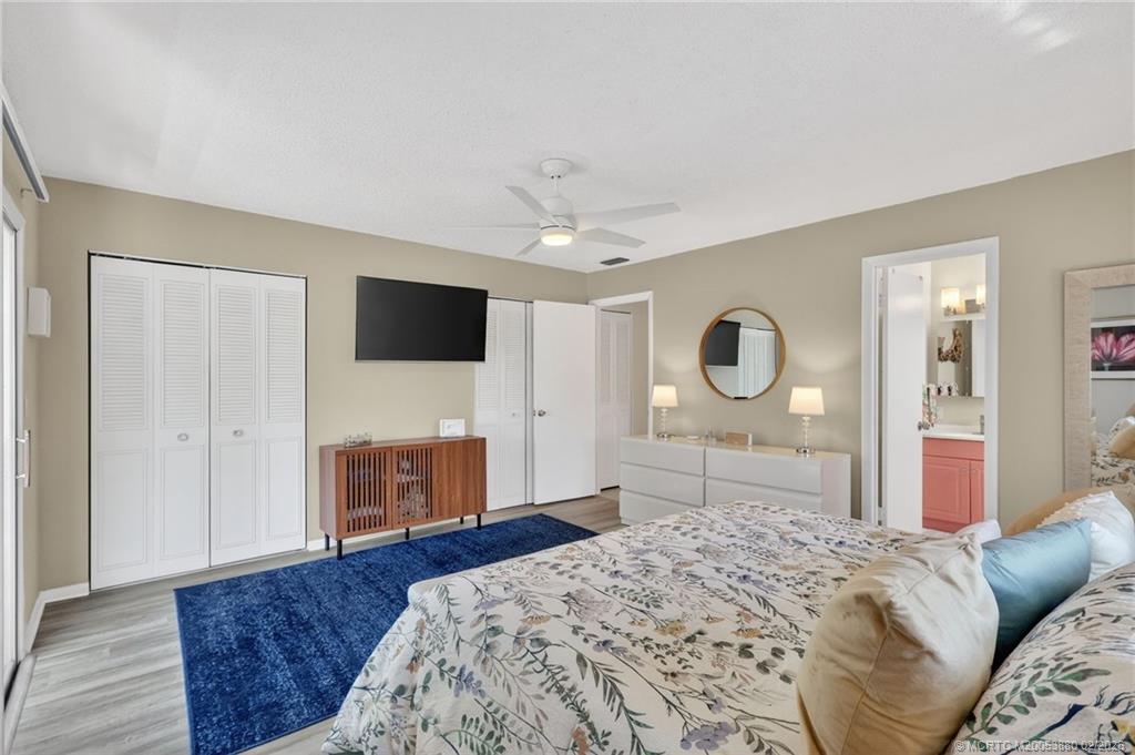 2600 Southeast Ocean Boulevard, Unit M10 Stuart, FL 34996 - Photo 14 of 36 Bedroom with en suite bathroom.