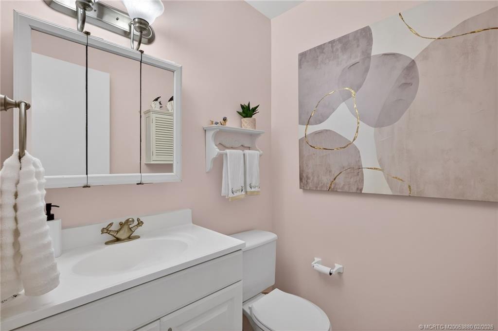 2600 Southeast Ocean Boulevard, Unit M10 Stuart, FL 34996 - Photo 9 of 36 Convenient powder room in the hallway.