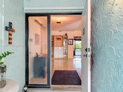 a view of a bathroom with a glass door