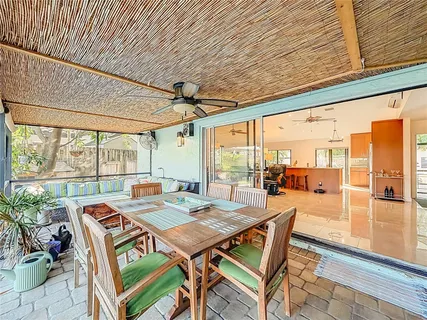 a view of an outdoor dining space with furniture