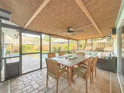 a view of a dining room with furniture window and outside view