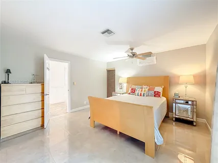 a bedroom with a bed and a cabinets