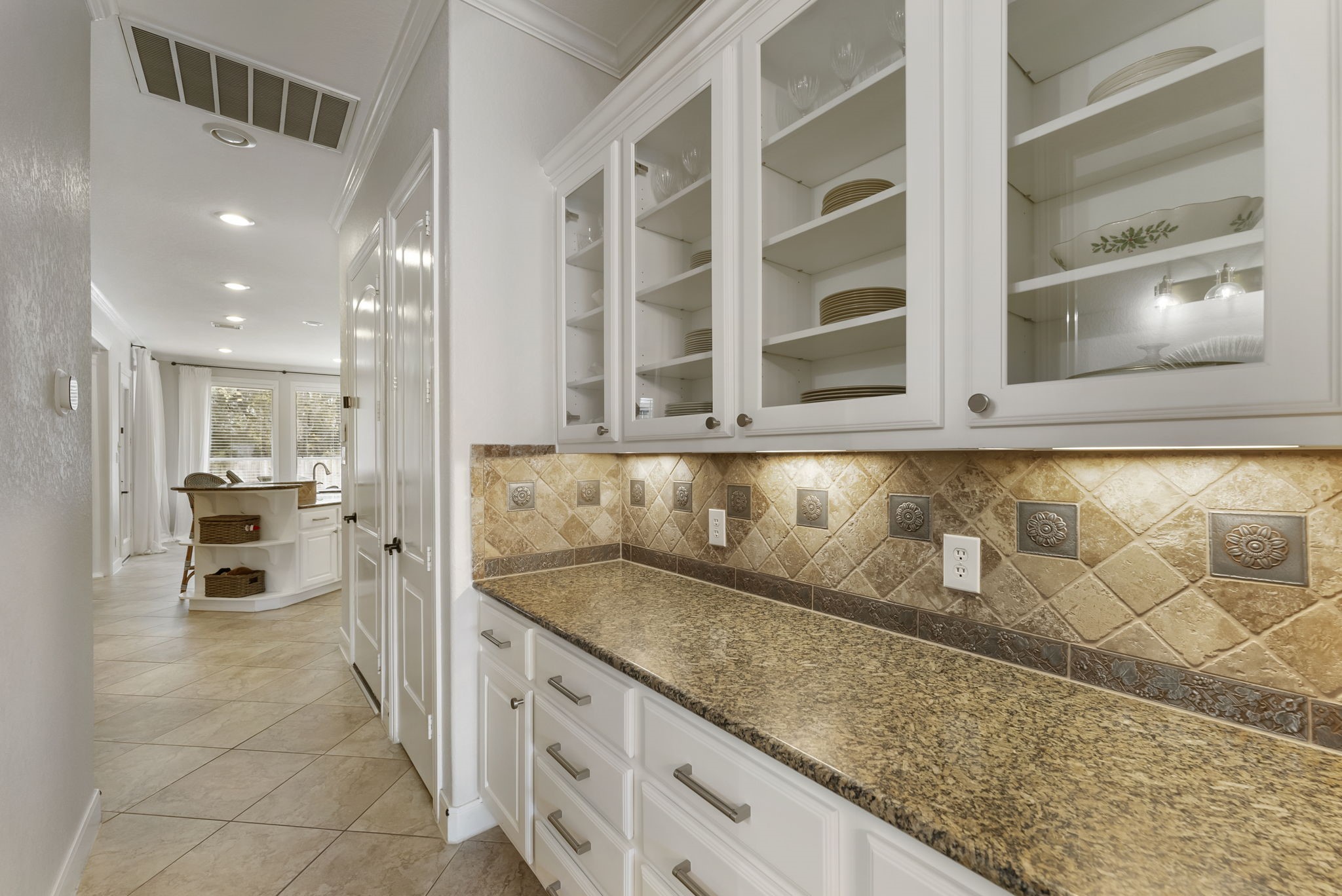 6 Lagato Place Spring, TX 77382 - Photo 15 of 42 A functional butler’s pantry offers additional prep space, storage, and display cabinetry. Thoughtfully placed between the kitchen and dining room for easy entertaining.