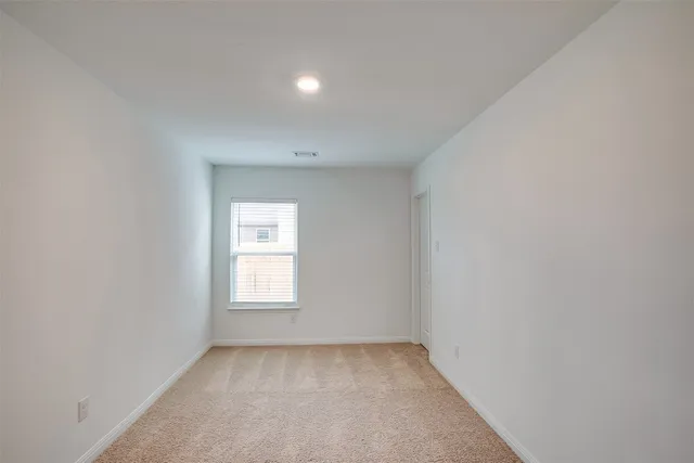 a view of a window in an empty room