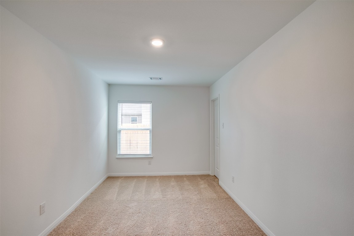 609 Riverdale Cove Jarrell, TX 76537 - Photo 13 of 17 a view of a window in an empty room