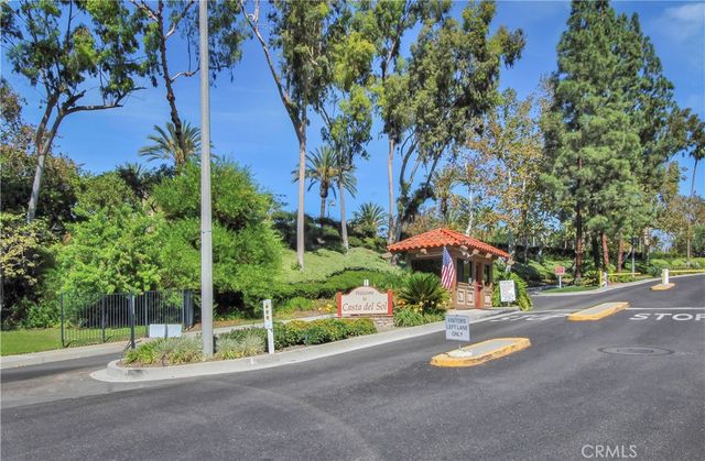 a view of a park with plants and a bench