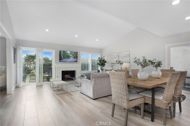 a view of a livingroom with furniture window and wooden floor
