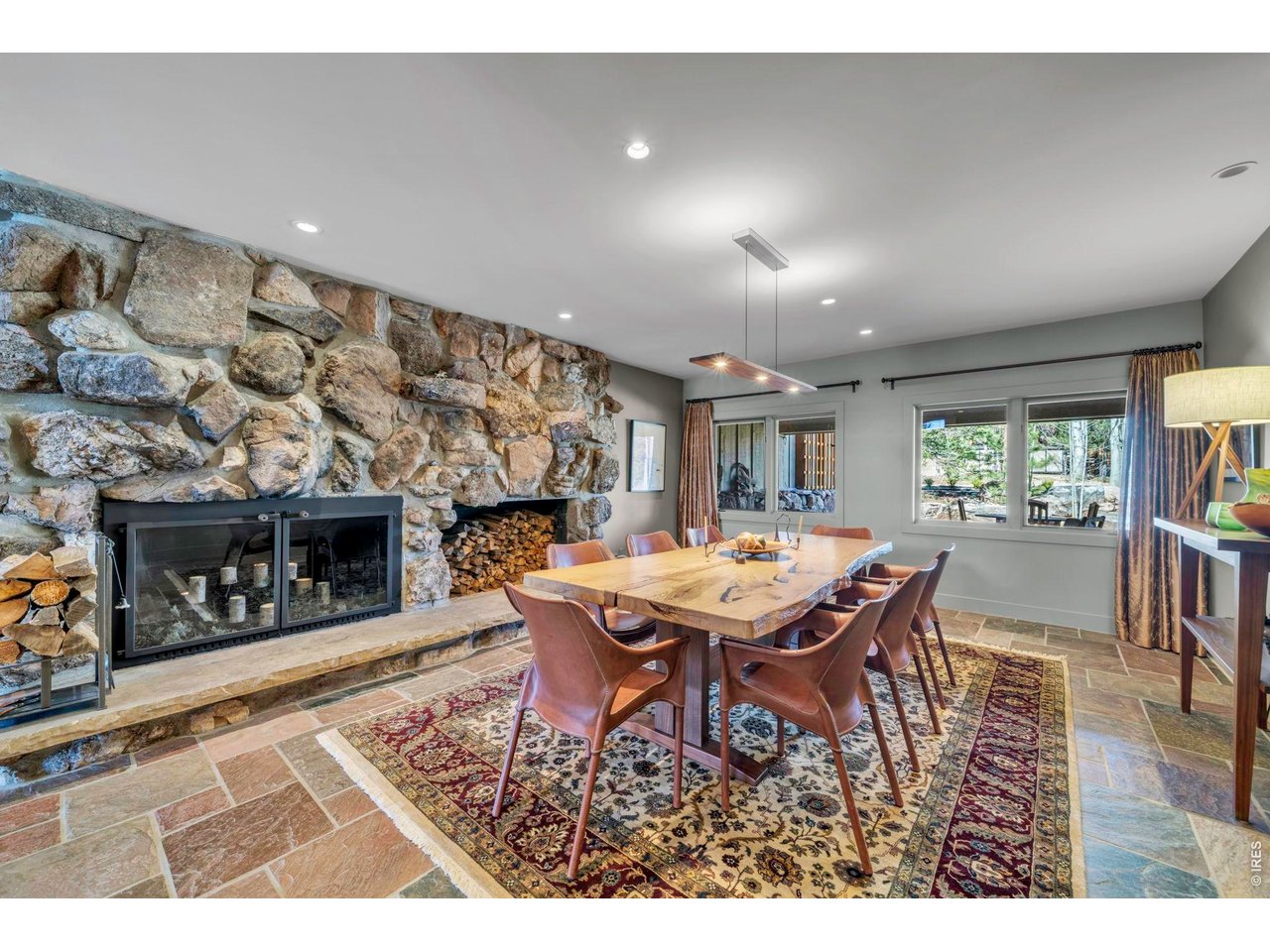 7321 Flagstaff Road Boulder, CO 80302 - Photo 13 of 50 Dining room with custom lighting and cozy fireplace