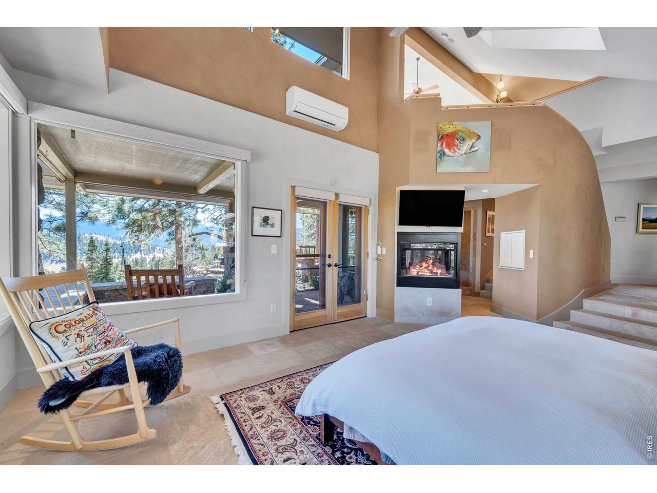 7321 Flagstaff Road Boulder, CO 80302 - Photo 16 of 50 Primary suite with double sided fireplace