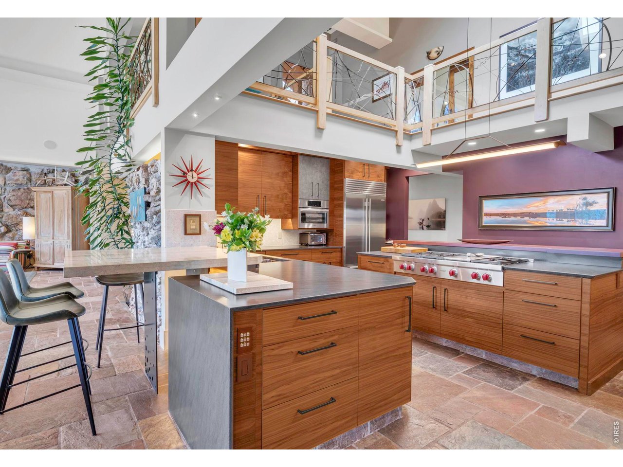 7321 Flagstaff Road Boulder, CO 80302 - Photo 8 of 50 Travertino breakfast table with custom backlighting plus lofty spaces with kitchen open to second floor