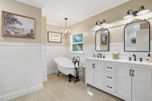 a spacious bathroom with a double vanity sink and a mirror