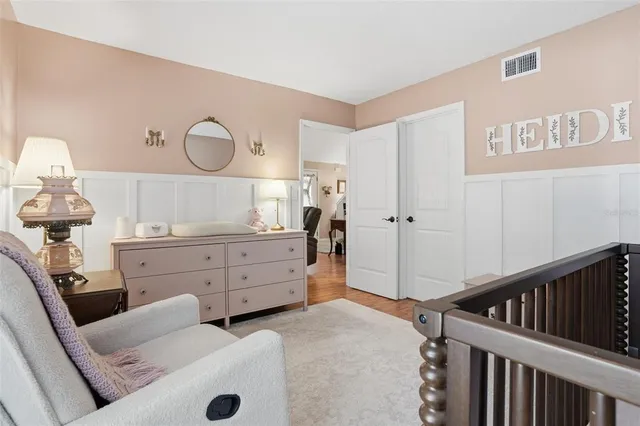 a bed room with a bed and a dresser