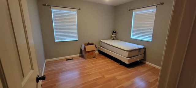 a room with a bed and a window