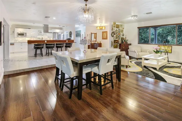 a view of a backyard with a tree