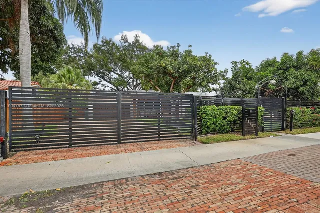 a view of a garden with an outdoor seating