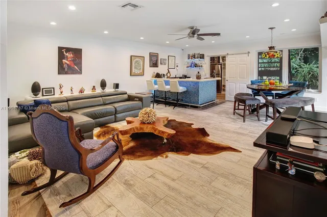 a bathroom with a sink toilet a mirror and shower