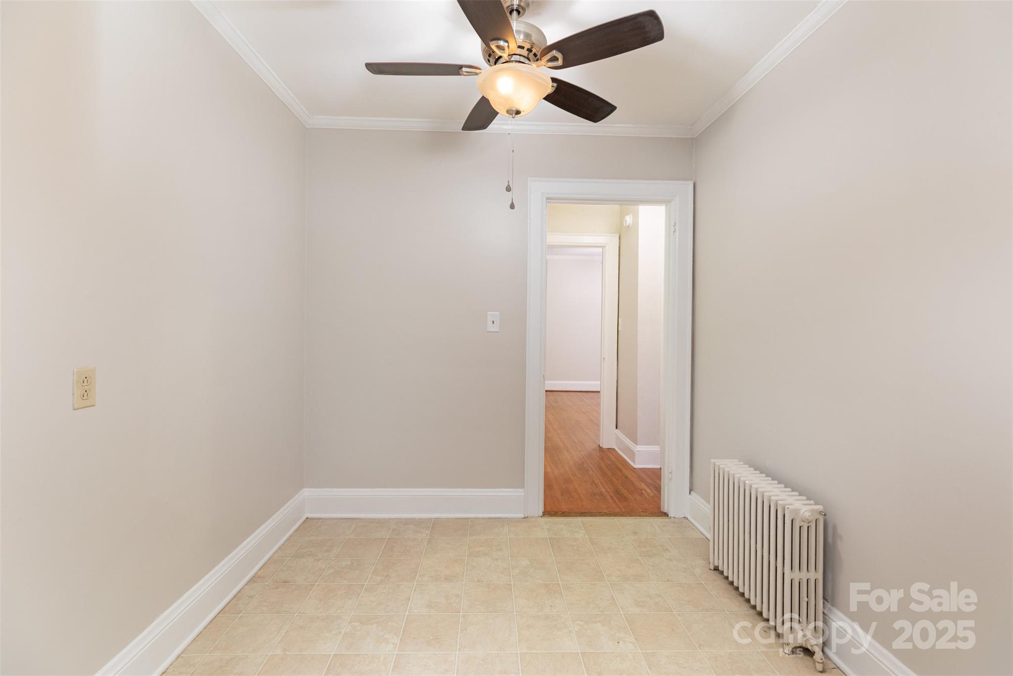 1412 Kenilworth Avenue Charlotte, NC 28203 - Photo 13 of 25 an empty room and chandelier fan