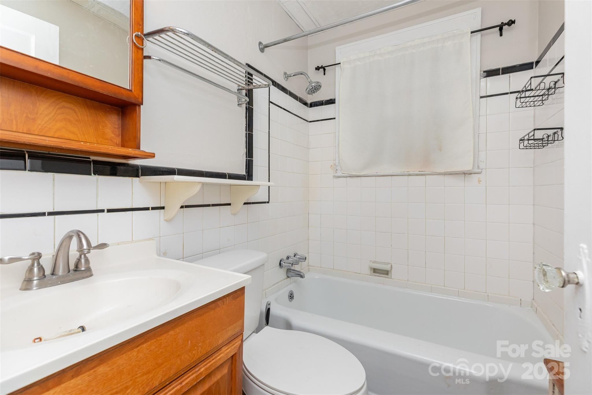 1412 Kenilworth Avenue Charlotte, NC 28203 - Photo 16 of 25 a bathroom with a sink toilet and shower