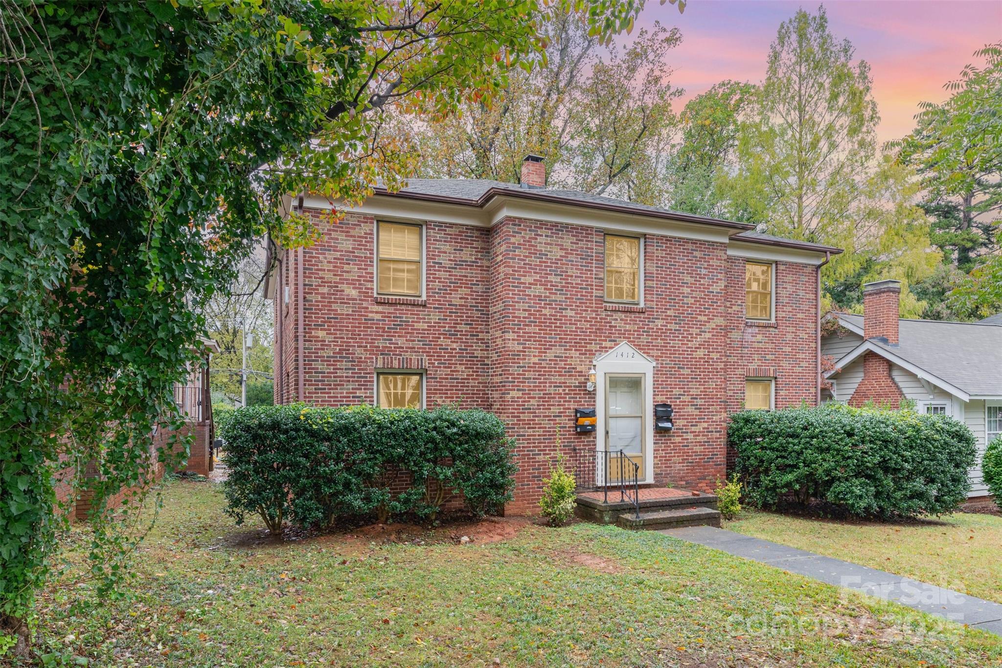 1412 Kenilworth Avenue Charlotte, NC 28203 - Photo 19 of 25 a front view of a house with a yard