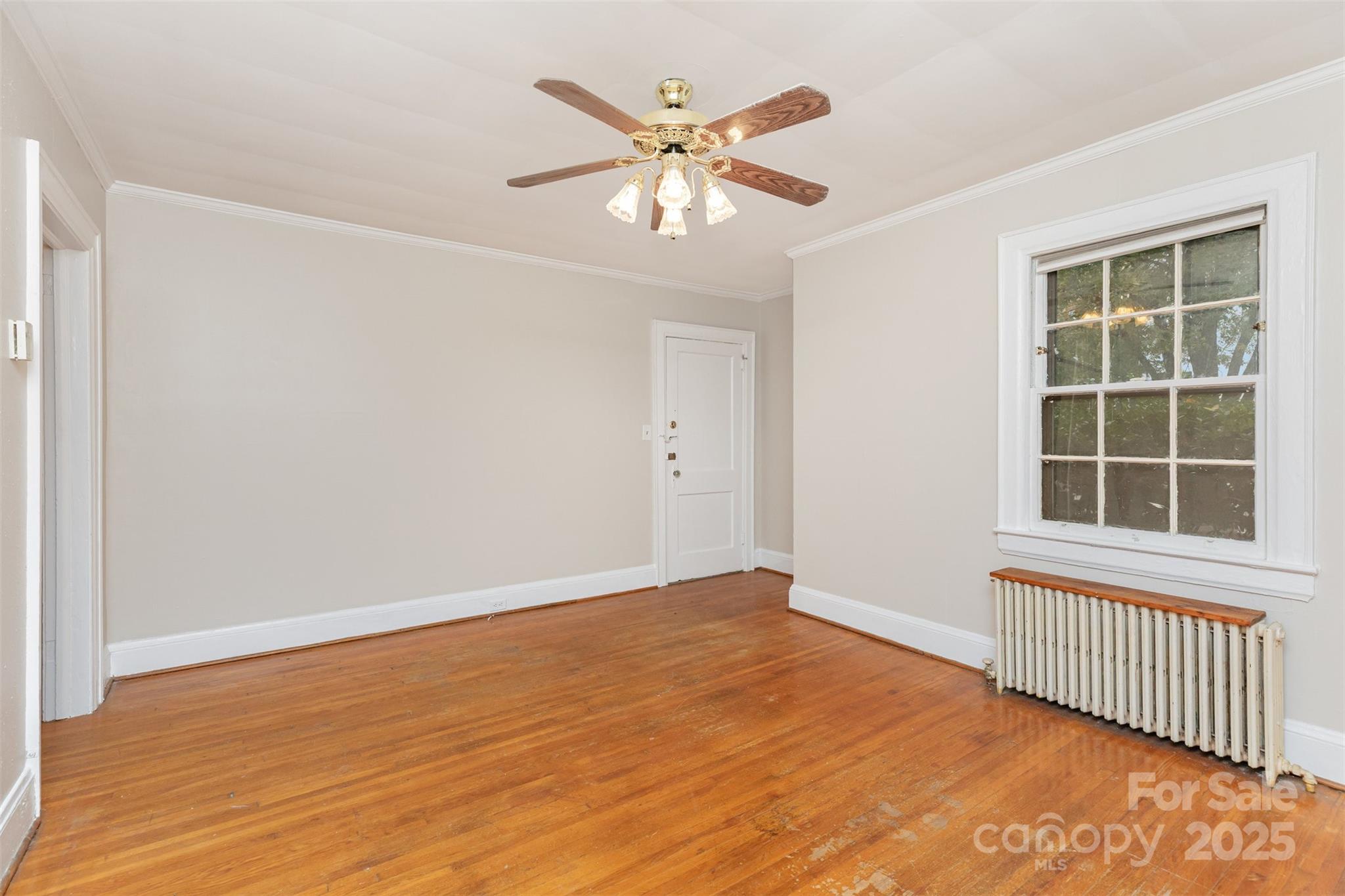 1412 Kenilworth Avenue Charlotte, NC 28203 - Photo 7 of 25 an empty room with windows and fan