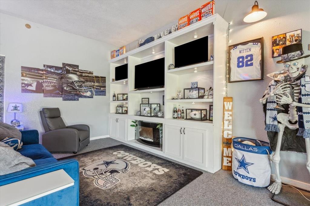 3356 Kattner Road Riesel, TX 76682 - Photo 25 of 40 a living room with furniture and a flat screen tv