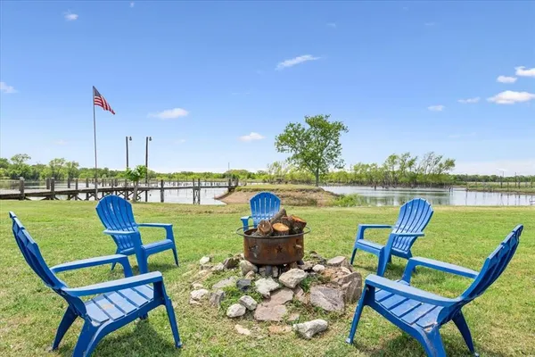 a view of a lake with a yard