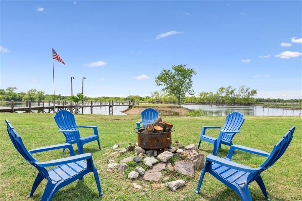 3356 Kattner Road Riesel, TX 76682 - Photo 34 of 40 a view of a lake with couches chairs