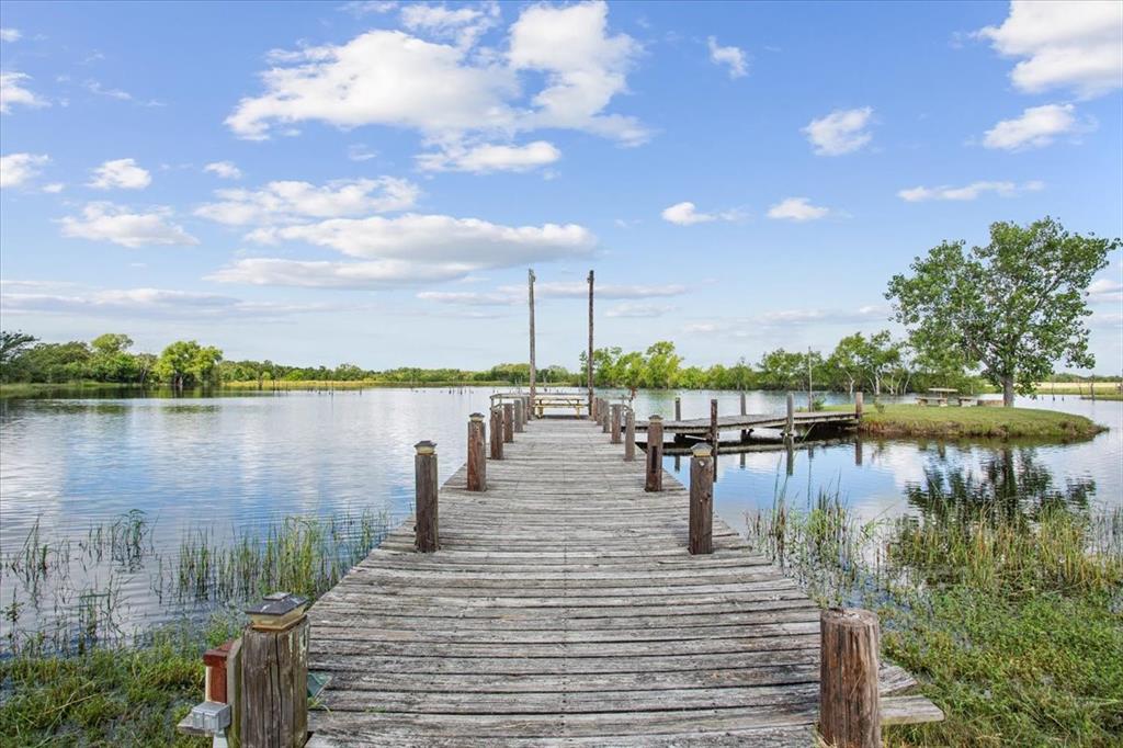 3356 Kattner Road Riesel, TX 76682 - Photo 37 of 40 a view of a lake with boats and trees