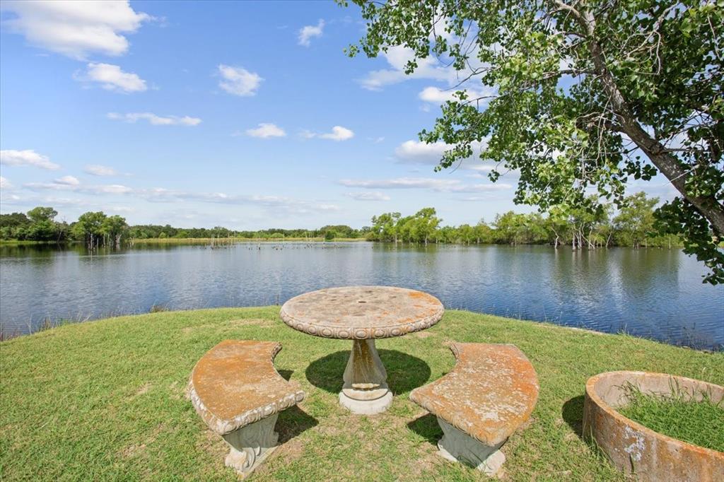 3356 Kattner Road Riesel, TX 76682 - Photo 38 of 40 a view of a lake with couches and wooden floor