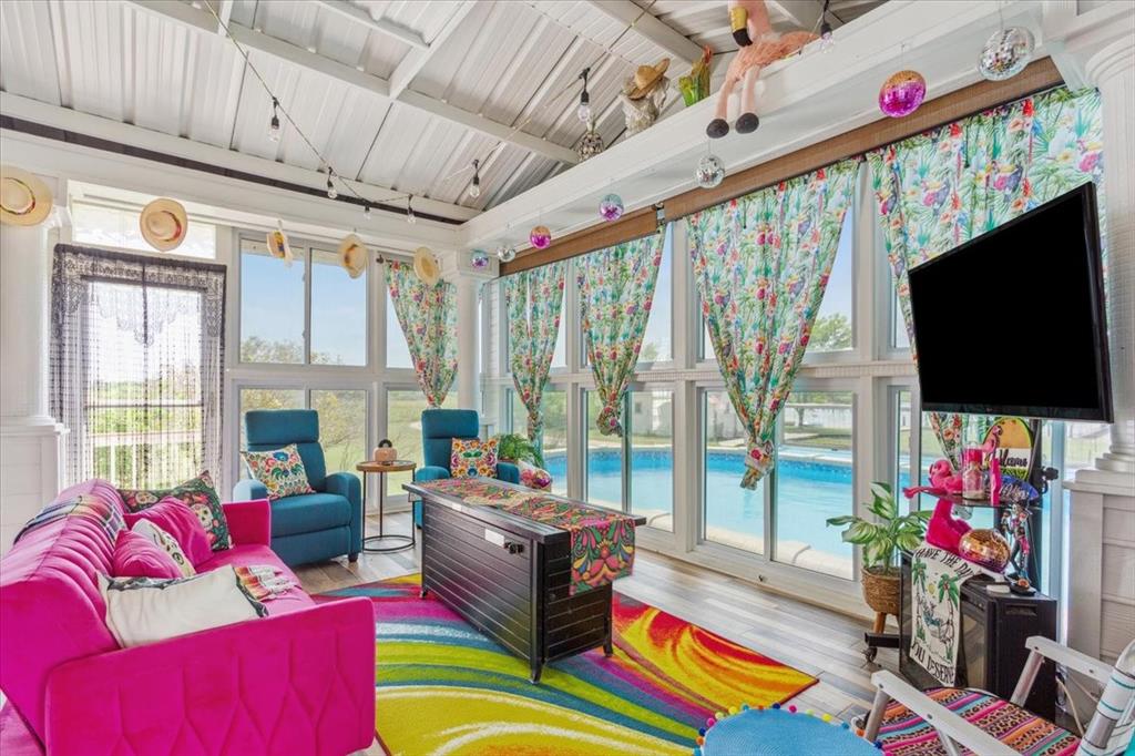 3356 Kattner Road Riesel, TX 76682 - Photo 10 of 40 a living room with patio furniture and a flat screen tv