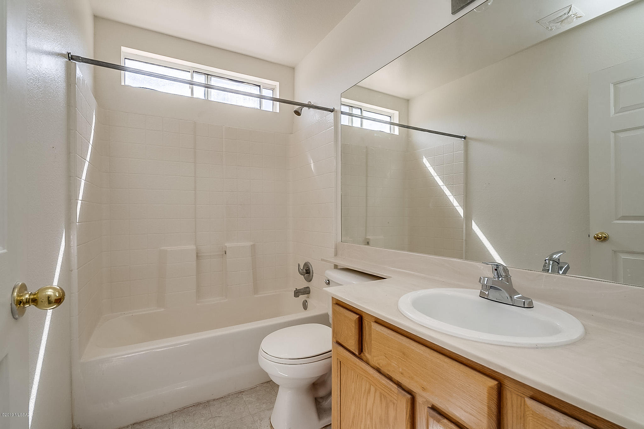 410 Wrightson Street Rio Rico, AZ 85648 - Photo 33 of 50 a bathroom with a sink toilet and shower