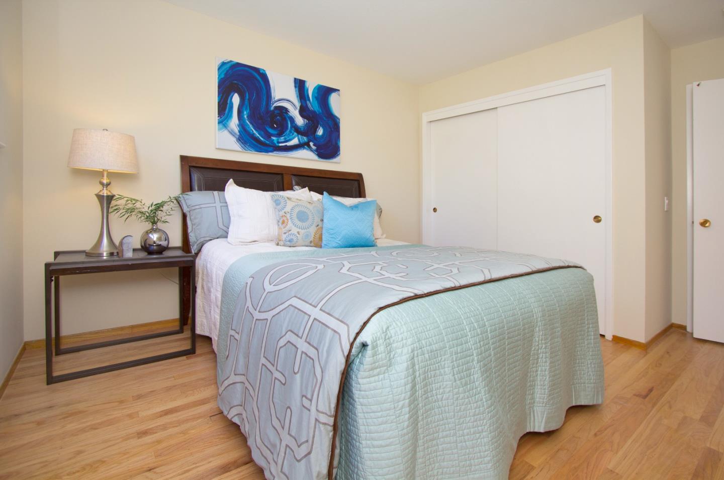 655 Gilbert Avenue Menlo Park, CA 94025 - Photo 21 of 28 a bedroom with a bed and wooden floor