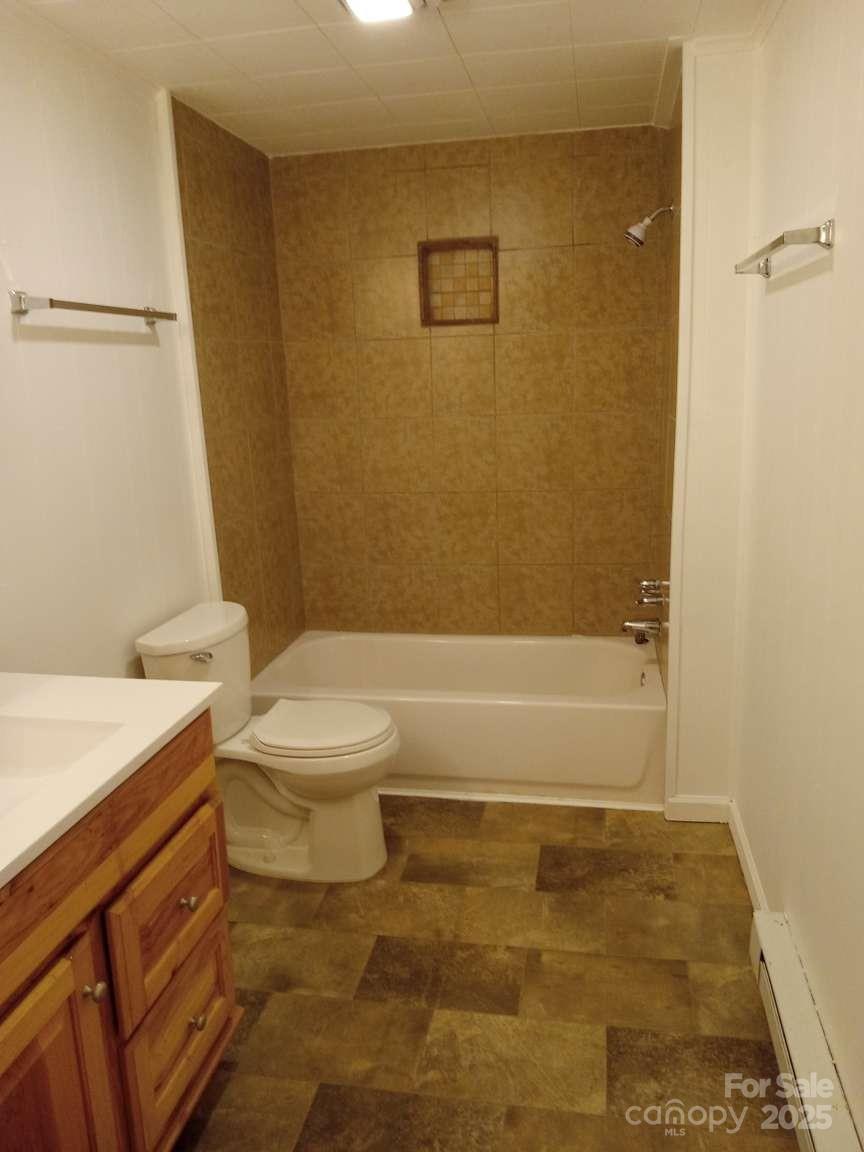 381 North Cleghorn Street Rutherfordton, NC 28139 - Photo 14 of 18 a bathroom with a toilet a sink and a shower