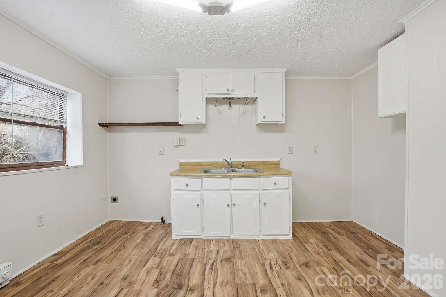 381 North Cleghorn Street Rutherfordton, NC 28139 - Photo 18 of 19 a room with a sink and cabinets