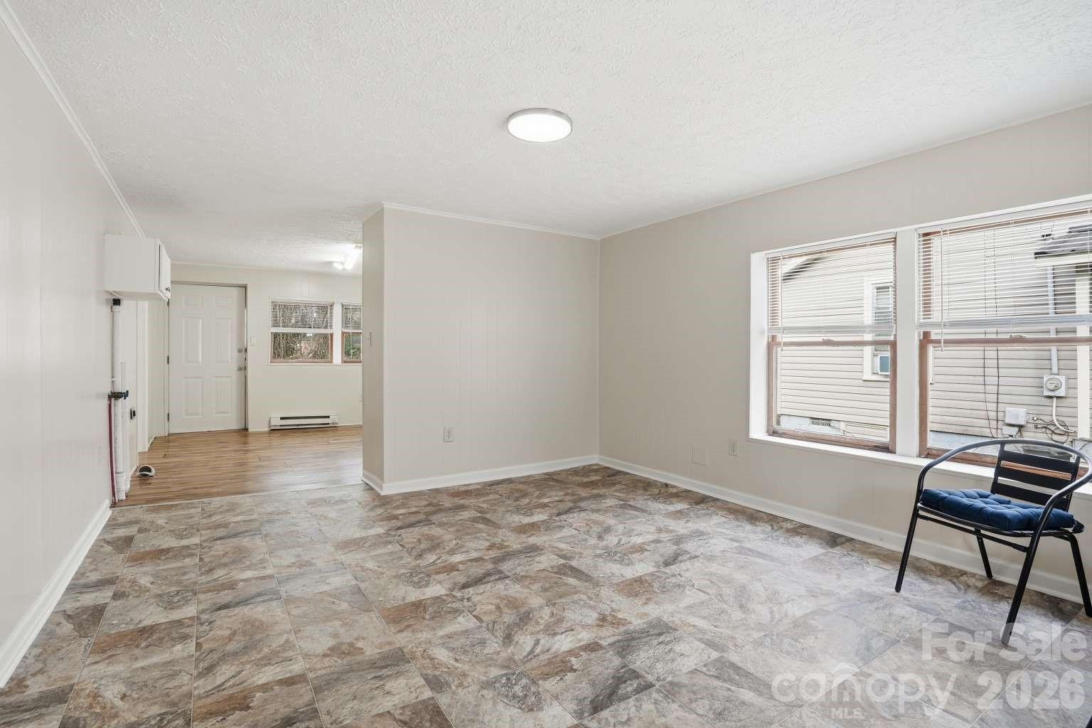 381 North Cleghorn Street Rutherfordton, NC 28139 - Photo 5 of 19 a view of an empty room with a window