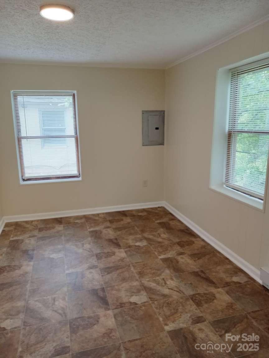 381 North Cleghorn Street Rutherfordton, NC 28139 - Photo 8 of 18 an empty room with a window
