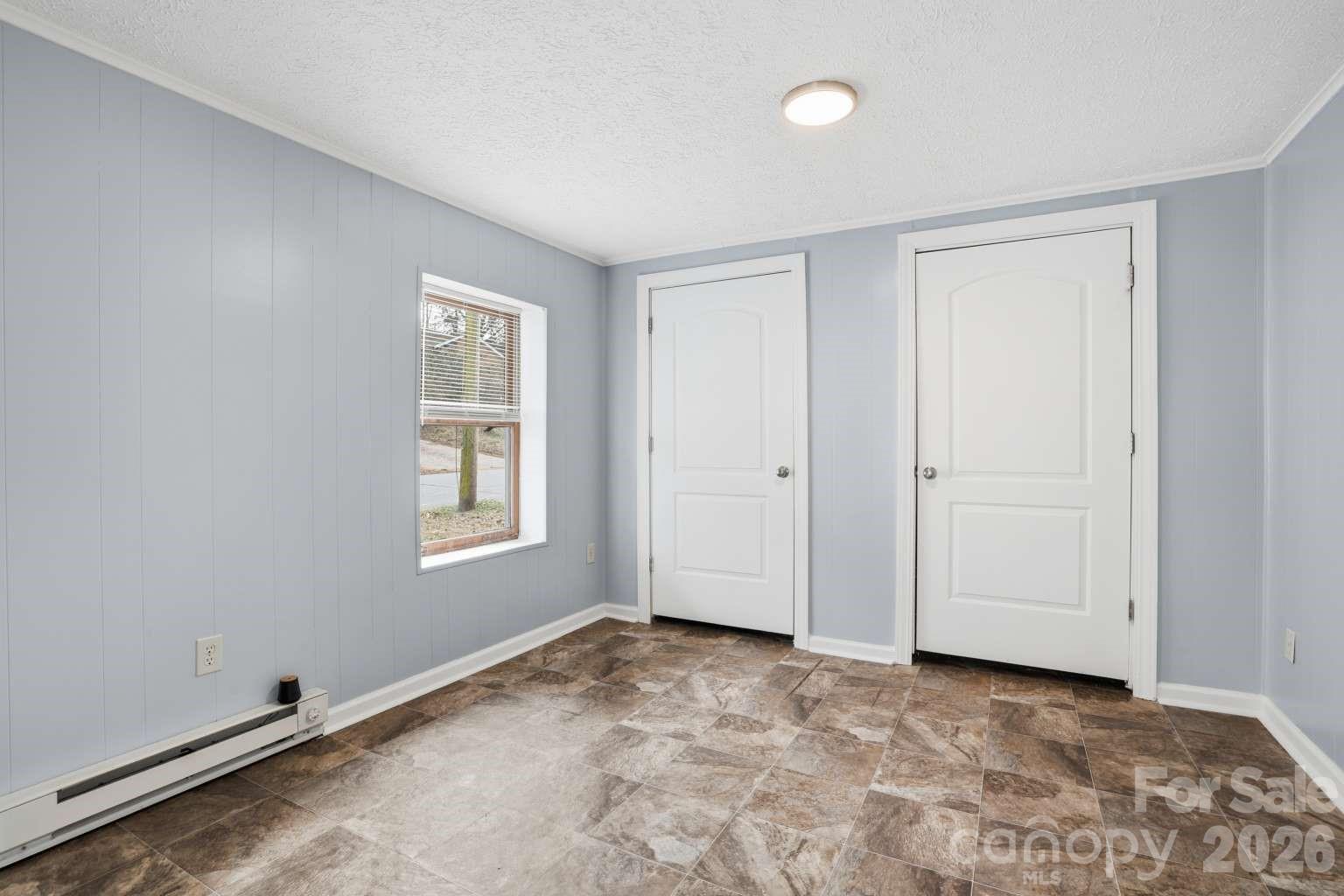 381 North Cleghorn Street Rutherfordton, NC 28139 - Photo 9 of 19 a view of an empty room with window and closet area