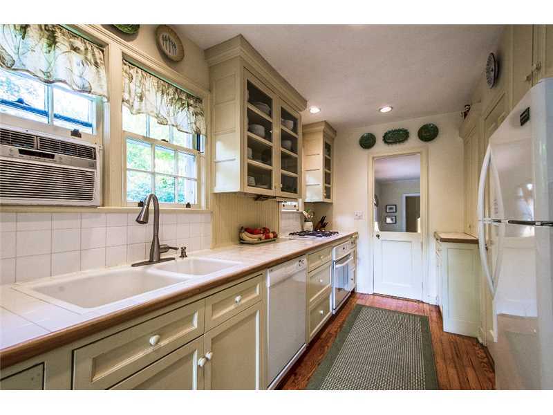 167 West Norwalk Road Norwalk, CT 06850 - Photo 12 of 24 a kitchen with a sink appliances cabinets and a large window