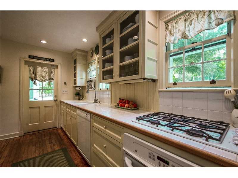 167 West Norwalk Road Norwalk, CT 06850 - Photo 13 of 24 a kitchen with a stove a sink and a window