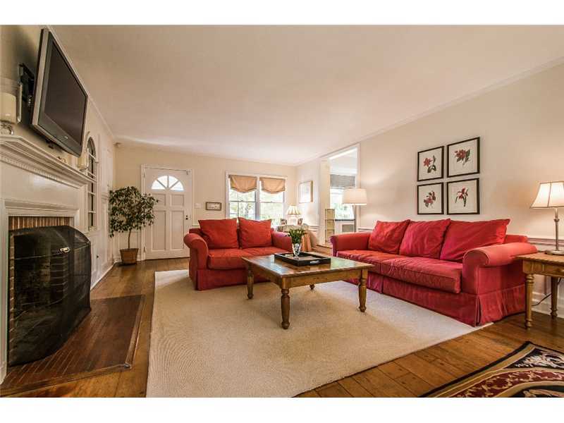 167 West Norwalk Road Norwalk, CT 06850 - Photo 5 of 24 a living room with furniture a fireplace and a flat screen tv